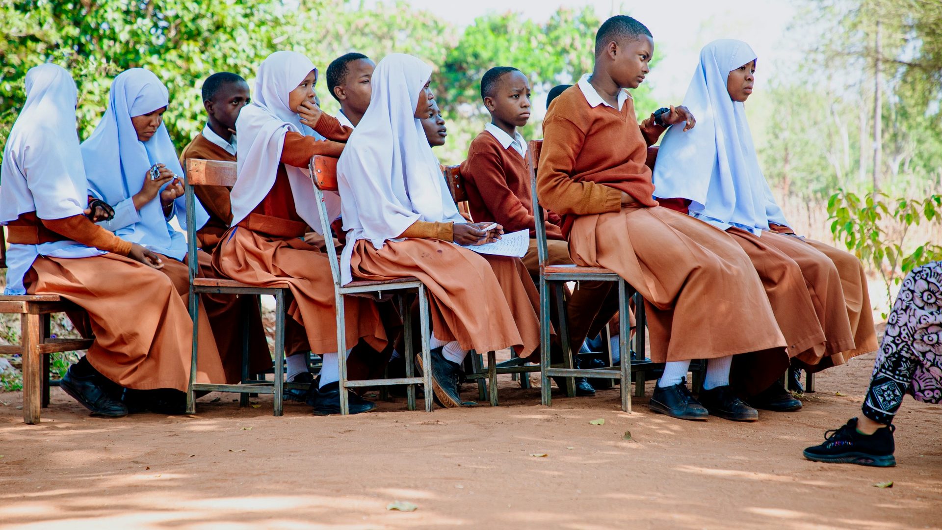 Students participating in an outdoor YEES TZ learning session.