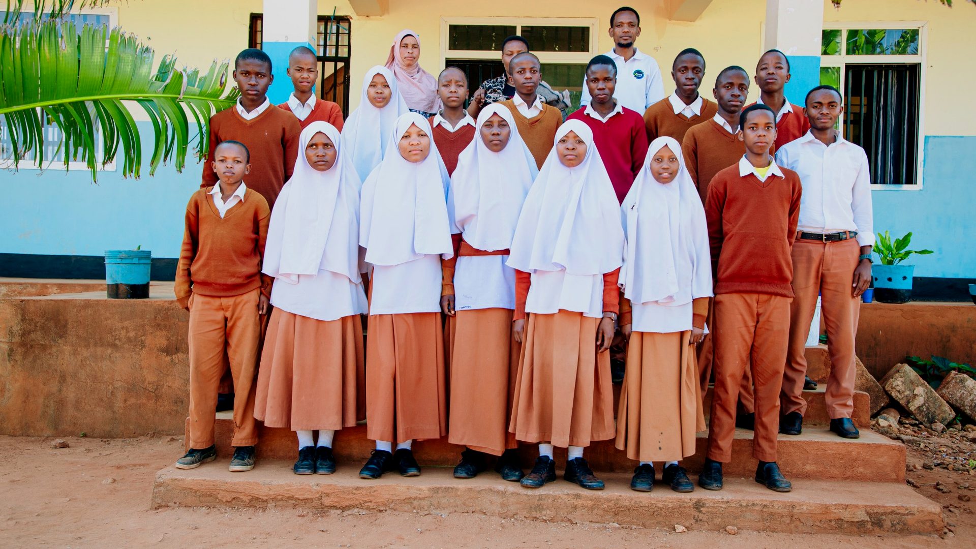 Students and facilitators together after a YEES TZ learning activity.