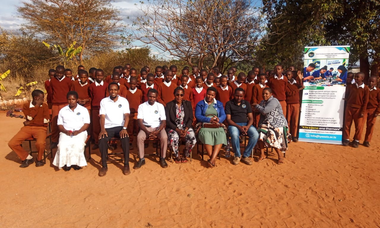 Group photograph of participants and organizers during a YEES TZ activity.